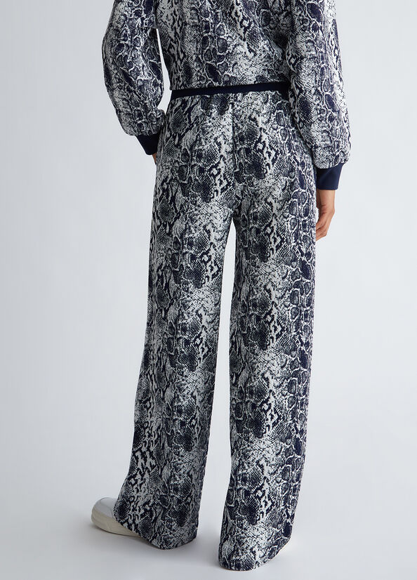 Pantaloni con stampa pitonata