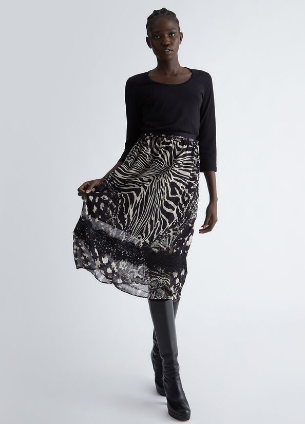 Vestito nero con gonna animalier