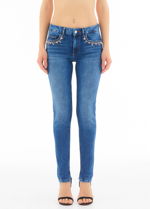 Jeans skinny con applicazioni gioiello