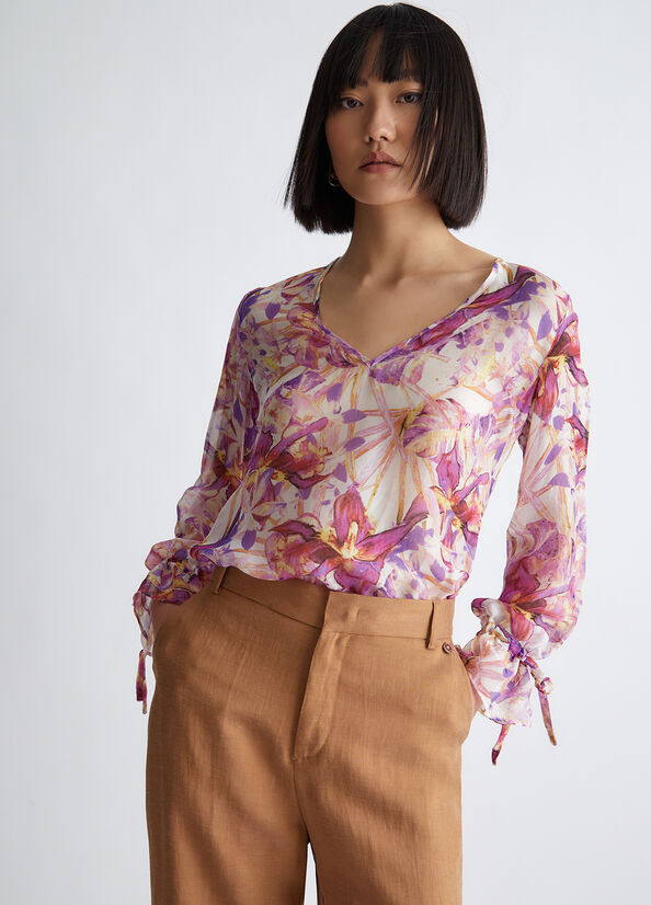 Blusa floreale in misto seta