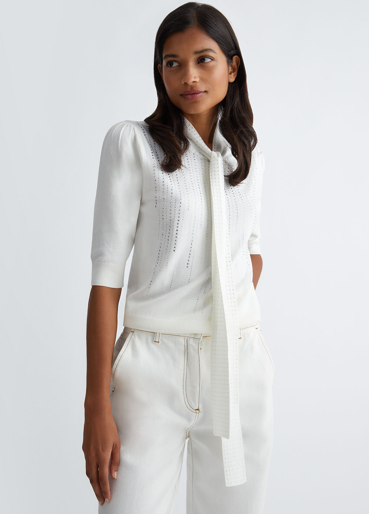 Jumper with bow and gemstones