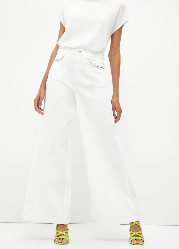 Pantaloni flare con borchie