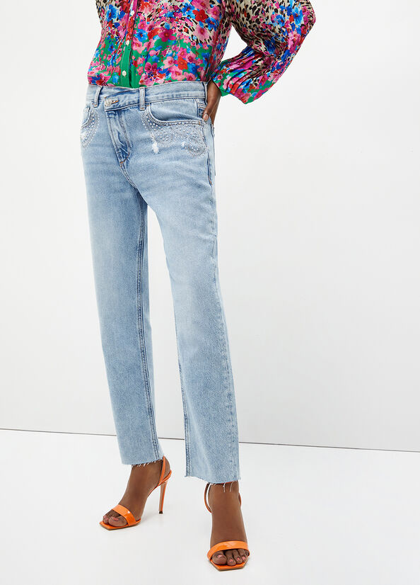 Jeans slim con applicazioni