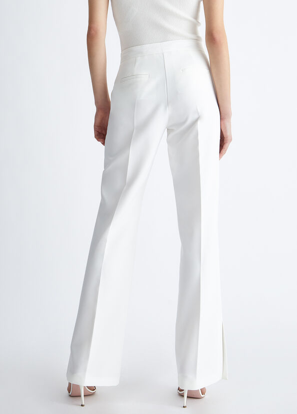 Pantaloni eleganti bianchi con spacchetto