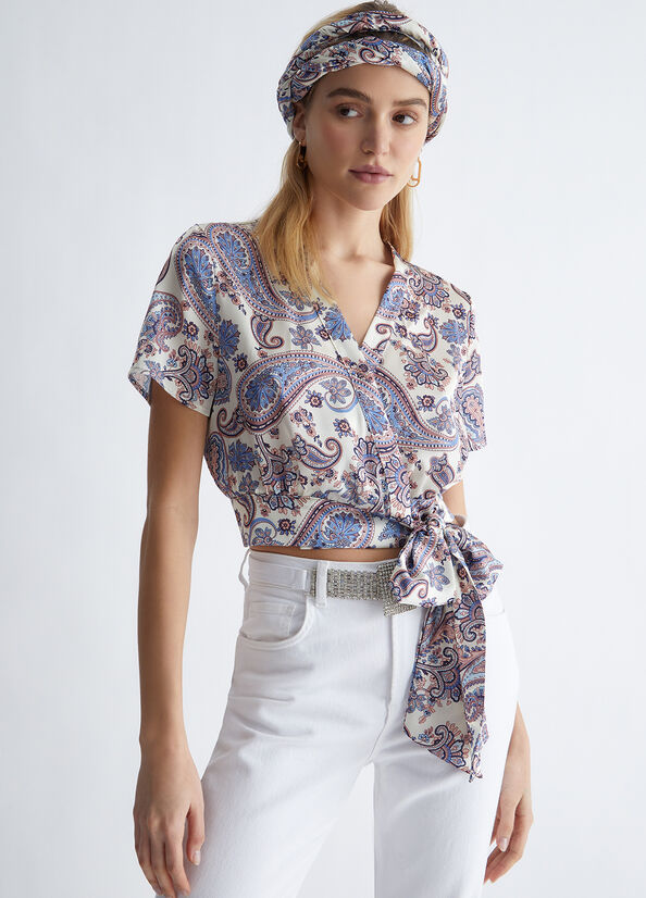 Blusa elegante con fiocco