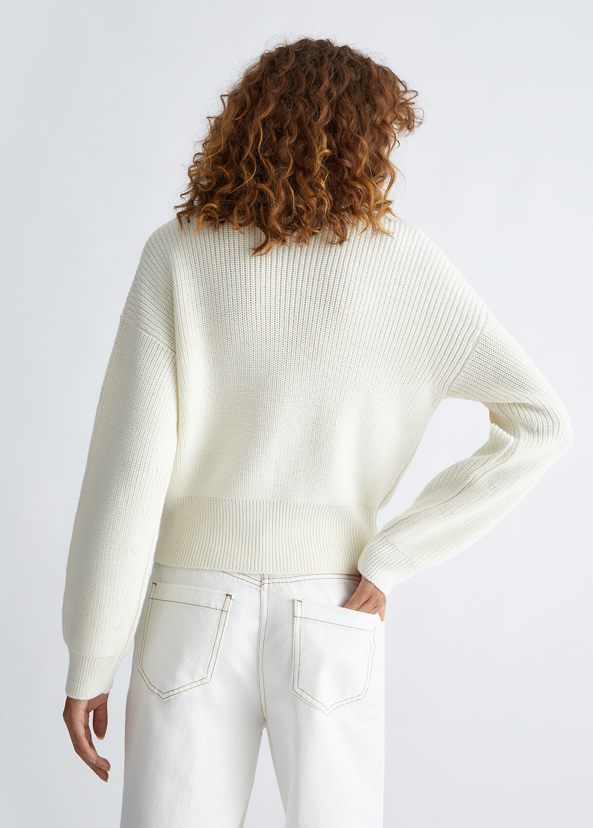 Wool turtleneck with gemstones