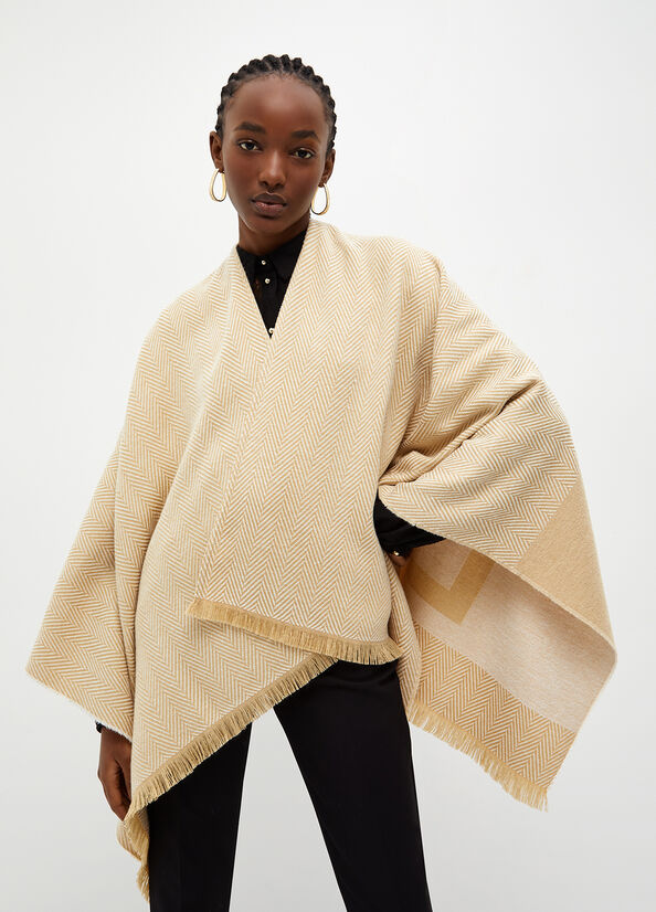 Poncho con logo jacquard
