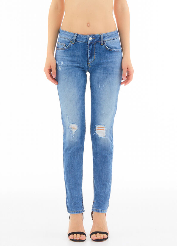 Jeans skinny con strappi e strass