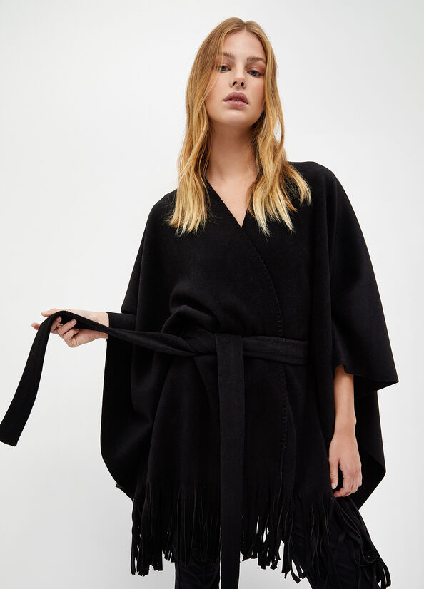 Poncho con frange e cintura