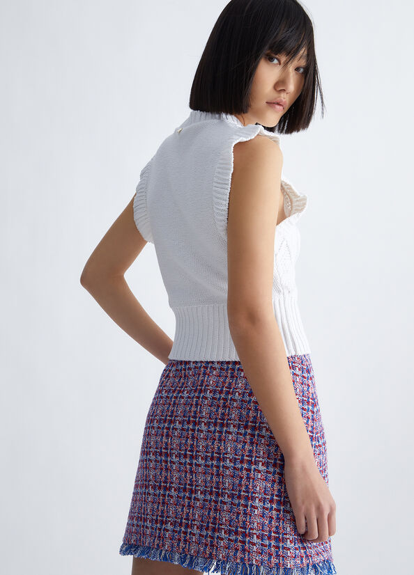Top in maglia con volant
