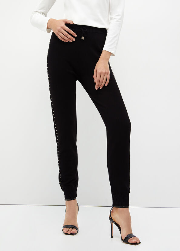 Pantaloni ecosostenibili con borchie