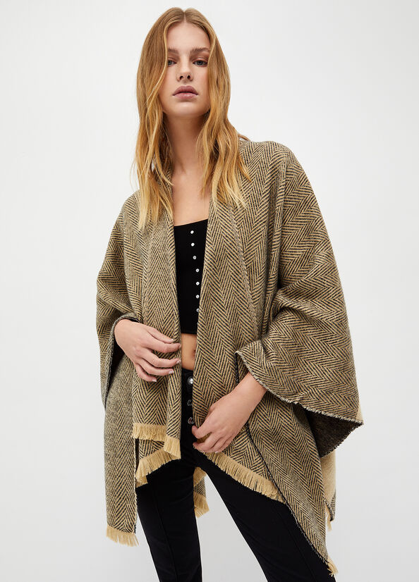Poncho con logo jacquard
