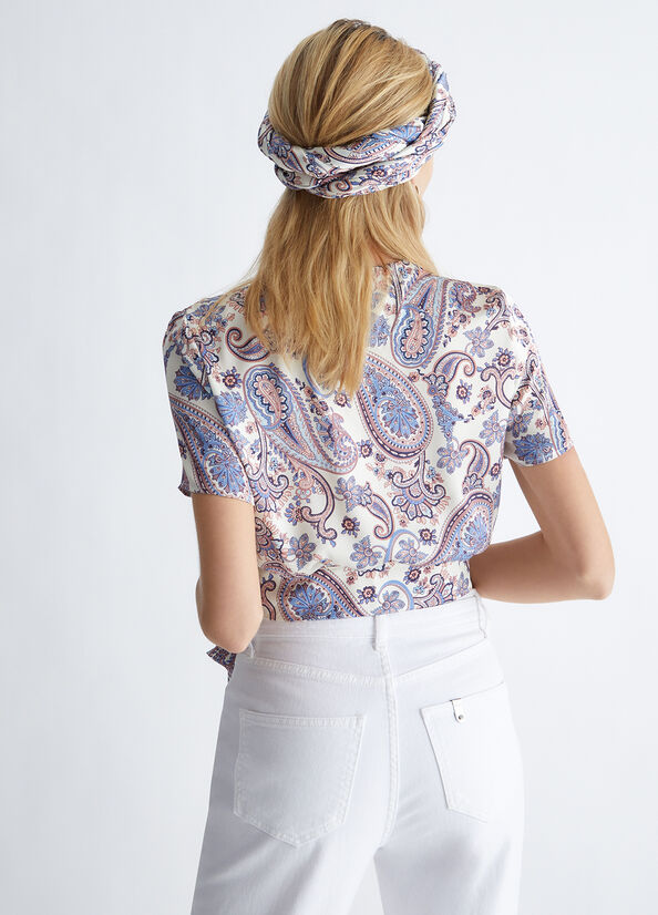 Blusa elegante con fiocco