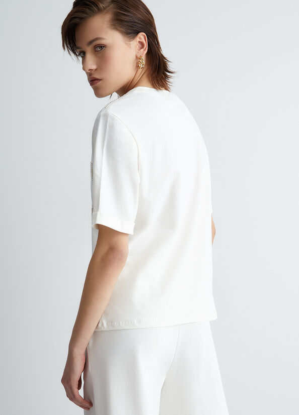 T-shirt con taschino e strass