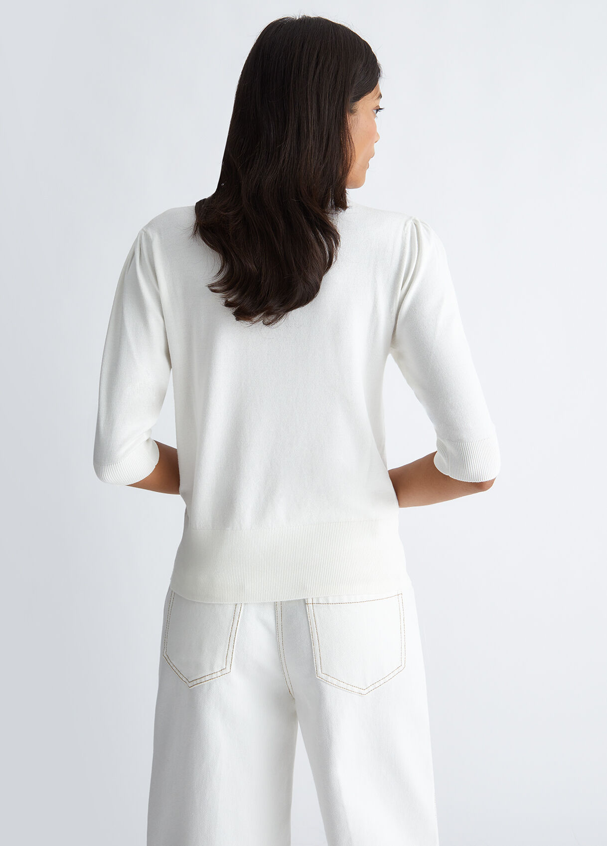 Jumper with bow and gemstones