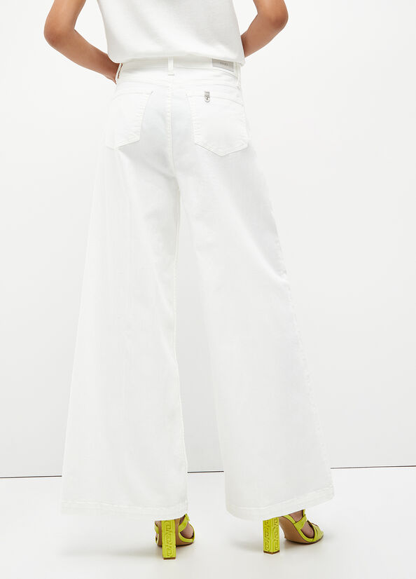 Pantaloni flare con borchie