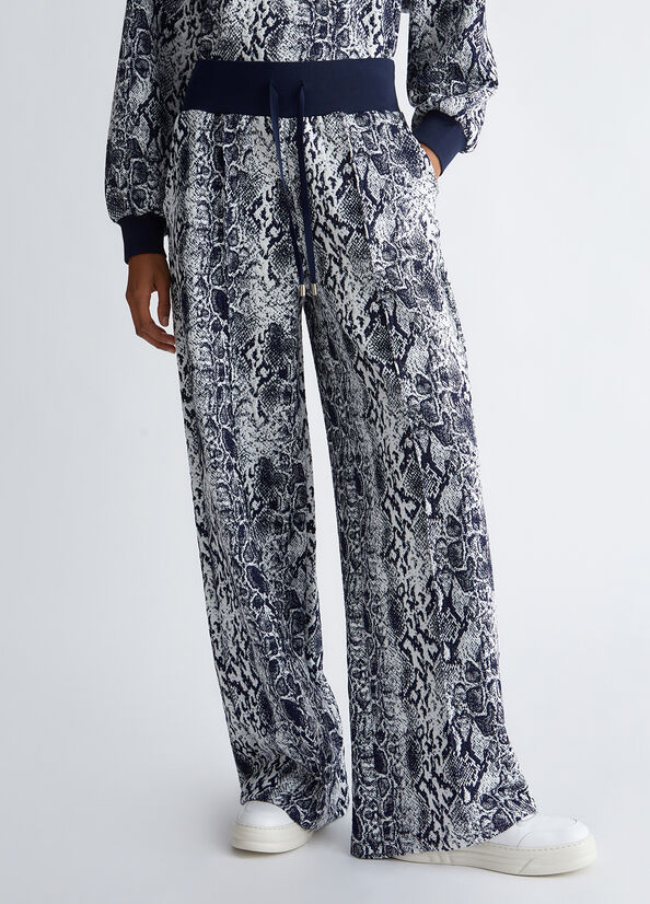 Pantaloni con stampa pitonata